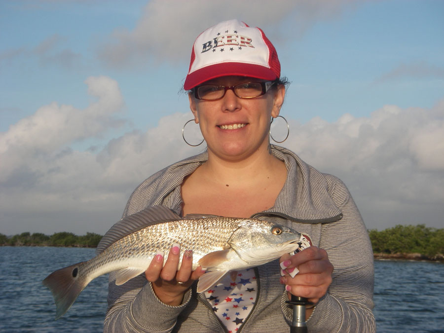 Tiffany got her red fishing the lagoon with Captain Mark Wright