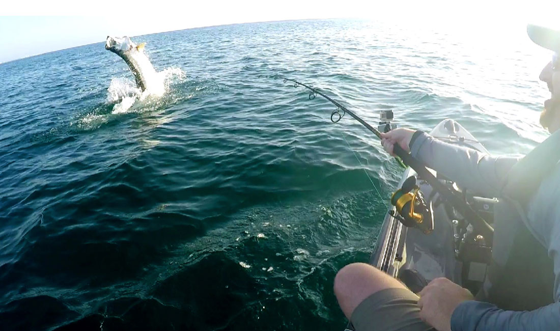 Ryan Wood hooks up with a huge tarpon while kayak fishing the beach in Central Florida