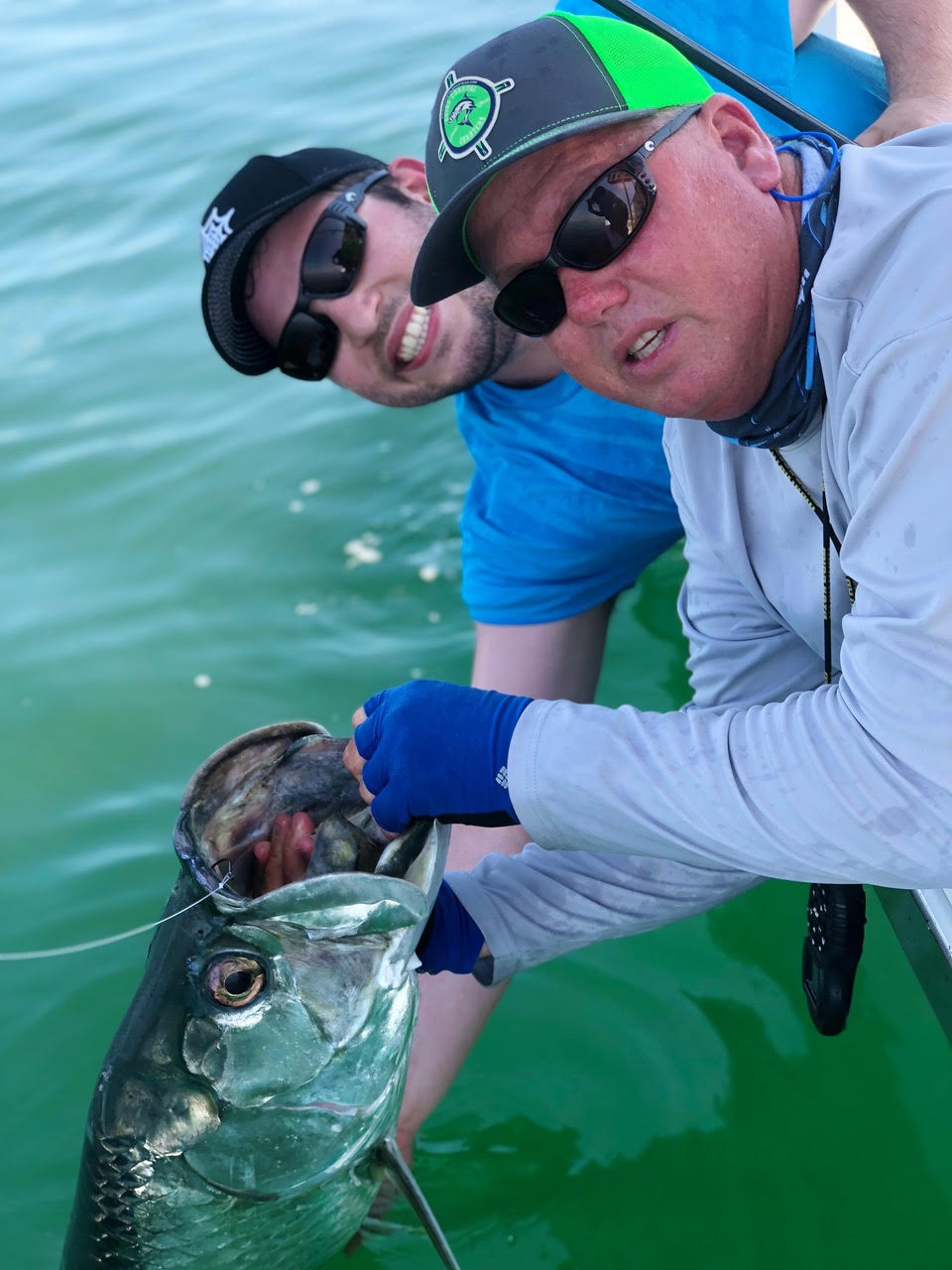 Capt. Glyn Austin and a nice tarpon he caught recently off the beach