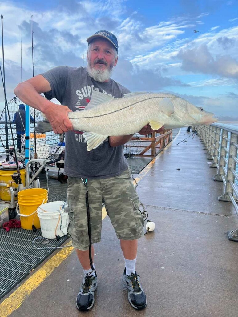 Donnie shows off a 38-inch snook he caught using live shrimp.