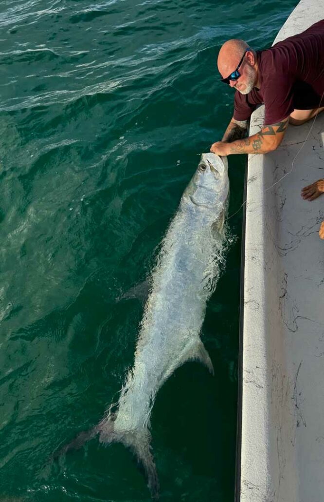 Adam with a nice Tarpon off the beach