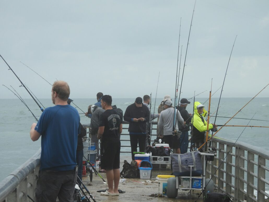 anglers in jetty fog